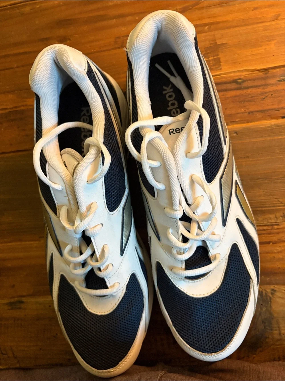 Like New Reebok size 10.5 Men's White and Navy Athletic Sneakers with Gold Accen
